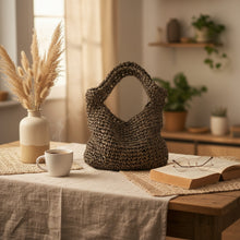 Load image into Gallery viewer, Green paper raffia crochet bag with handles on a table 

