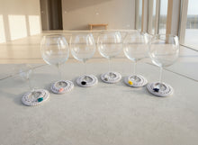 Load image into Gallery viewer, Decorative glass coasters with various embellishments on a gray surface
