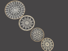 Load image into Gallery viewer, Four crocheted doilies with intricate patterns on a dark fabric background
