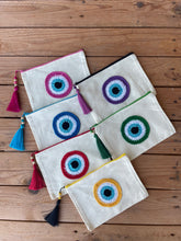Load image into Gallery viewer, White Canva Pouches with a Cotton Crochet Evil Eye Applique and a Tassel
