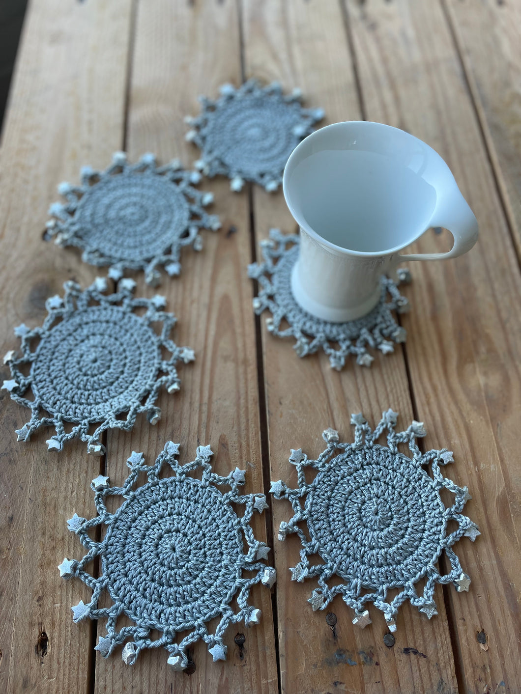Cotton gray coasters with silver stars