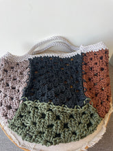 Load image into Gallery viewer, Crocheted bag with a geometric pattern in brown, blue, green, and gray on a light background.
