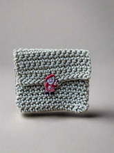 Load image into Gallery viewer, Crocheted pouch with a small santa claus button
