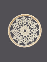 Load image into Gallery viewer, Round crochet doily on a gray fabric background
