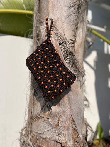 Brown woven pouch with orange beads 