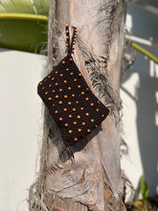 Brown woven pouch with orange beads 
