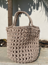 Load image into Gallery viewer, Beige crochet bag against a light background

