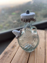 Load image into Gallery viewer, Glass teapot with decorative lid on a wooden surface
