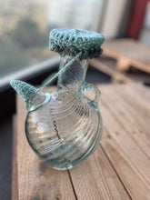 Load image into Gallery viewer, Glass bottle with a textured cap on a wooden surface
