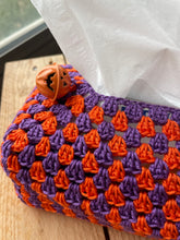 Load image into Gallery viewer, Crocheted phone case with orange and purple pattern on a white surface
