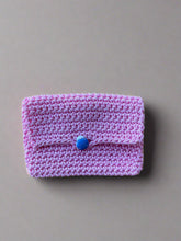 Load image into Gallery viewer, Pink knitted pouch with a blue ladybug button 
