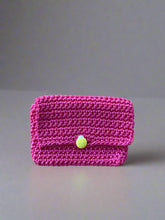 Load image into Gallery viewer, Pink knitted pouch with a yellow ladybug button 
