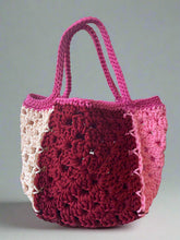 Load image into Gallery viewer, Crocheted bag with pink top and maroon body on a light surface
