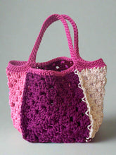 Load image into Gallery viewer, Crocheted bag with a purple front panel on a light background
