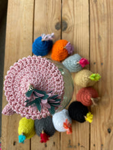Load image into Gallery viewer, Different colourful crochet water jug covers with a tassel
