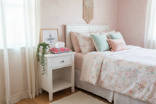 Load image into Gallery viewer, Crocheted tissue holder with pink and white pattern in a girl bedroom
