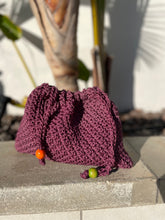 Load image into Gallery viewer, Knitted bag with colorful beads on a stone surface
