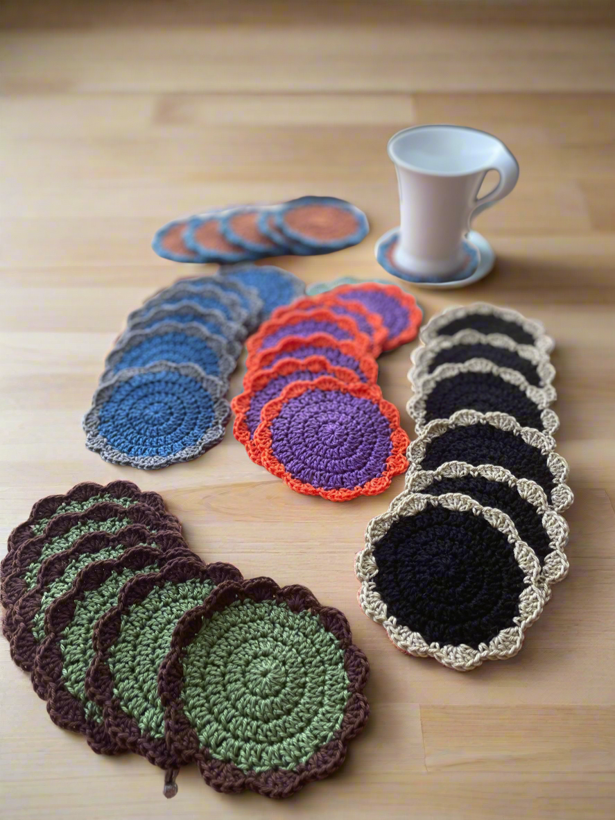 Collection of crocheted coasters in various colors on a wooden surface.