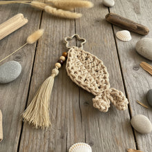Load image into Gallery viewer, Crocheted keychain with tassel on a gray background
