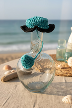 Load image into Gallery viewer, clear glass lebanese ibriq with blue black crochet cover 
