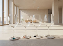 Load image into Gallery viewer, Wine glasses with crochet coasters on a concrete surface

