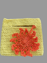 Load image into Gallery viewer, Yellow crocheted pouch with and orange floral design on a wooden surface

