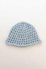 Load image into Gallery viewer, blue crochet mesh hat on a white surface 
