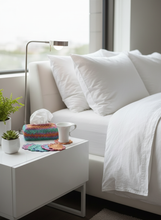 Load image into Gallery viewer, Colorful Crochet Coasters and Tissue Box Cover on Bedside Table
