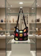 Load image into Gallery viewer, Crochet tote bag in boutique vitrine
