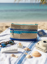 Load image into Gallery viewer, Ecru and blue crochet pouch lifestyle setting
