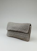 Load image into Gallery viewer, Close-up of a folded textured fabric on a light gray background
