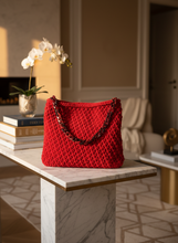Load image into Gallery viewer, Red velvet crochet bag with handle lifestyle background
