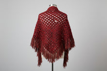 Load image into Gallery viewer, Person wearing a red patterned shawl in a room with a decorated Christmas tree and a table with a blanket.
