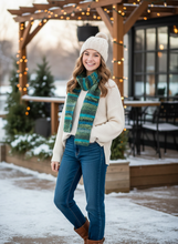 Load image into Gallery viewer, Teenager wearing green blue crochet winter scarf
