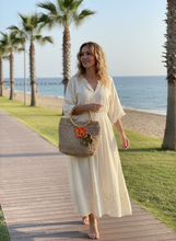 Load image into Gallery viewer, Woman Holding Beige Raffia Crochet Bag
