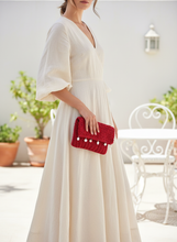Load image into Gallery viewer, Woman holding Red Crochet Clutch in lighter setting
