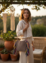 Load image into Gallery viewer, Woman holding taupe crochet bag lifestyle shot
