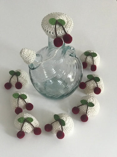 Crocheted off white water jug lid with cherries 